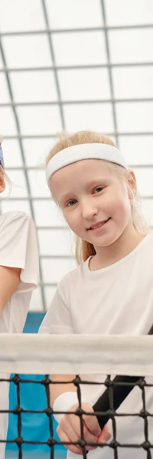 two-cute-blond-girls-in-white-sportswear-standing-2023-11-27-05-13-40-utc copy